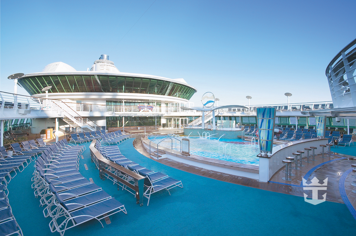 View of pool deck Solarium with lounge chairs and whirlpools